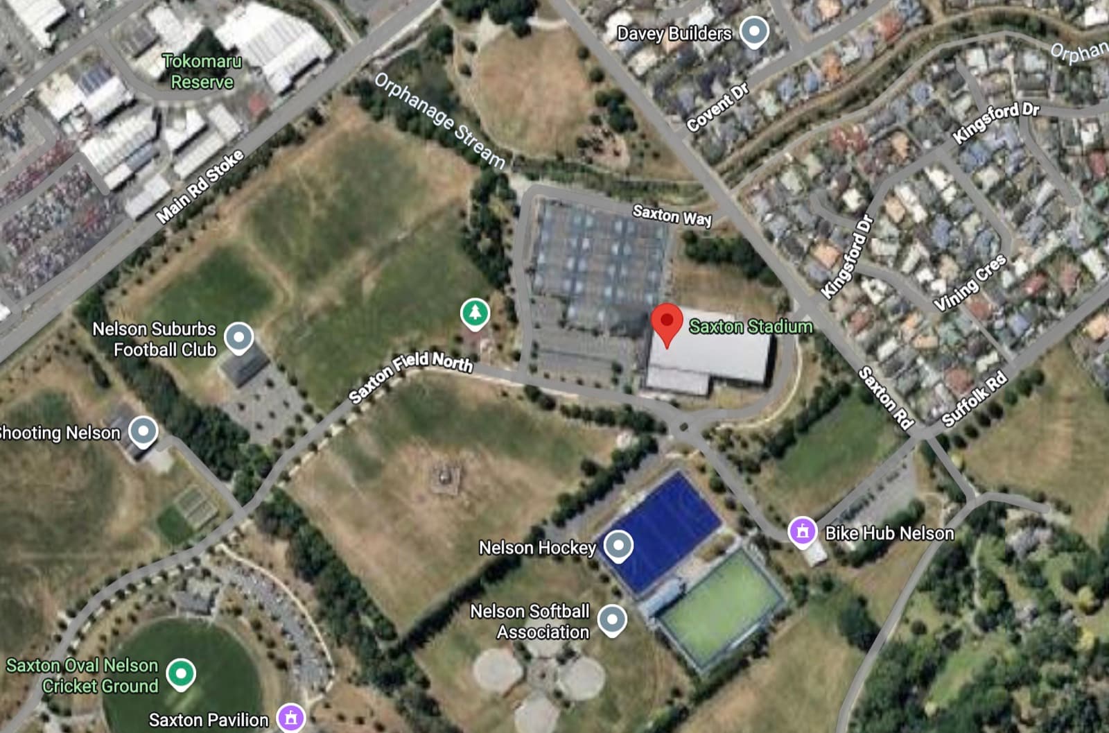 Aerial map of Saxton Field, Stoke, with Saxton Stadium marked — bounded by Main Road Stoke, Saxton Road and Saxton Field North, with the sports fields, hockey turf and Saxton Oval around it.
